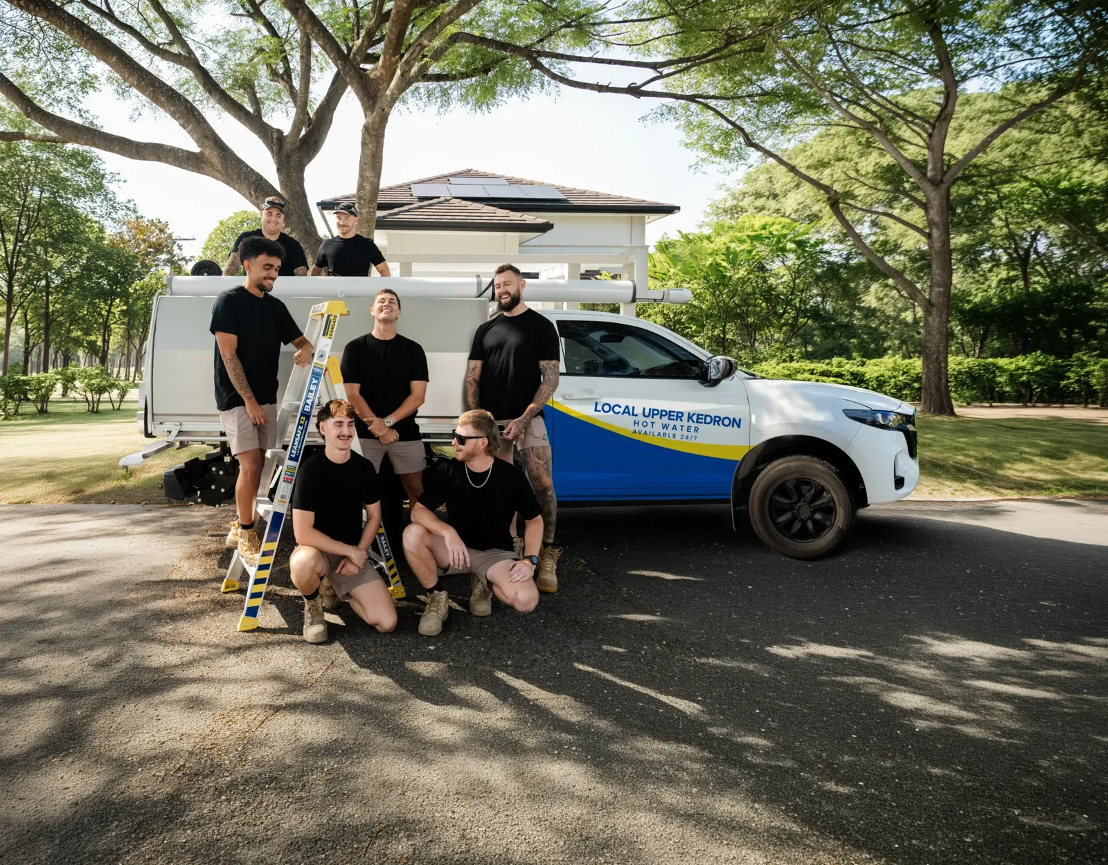 Local Upper Kedron Hot Water team and ute